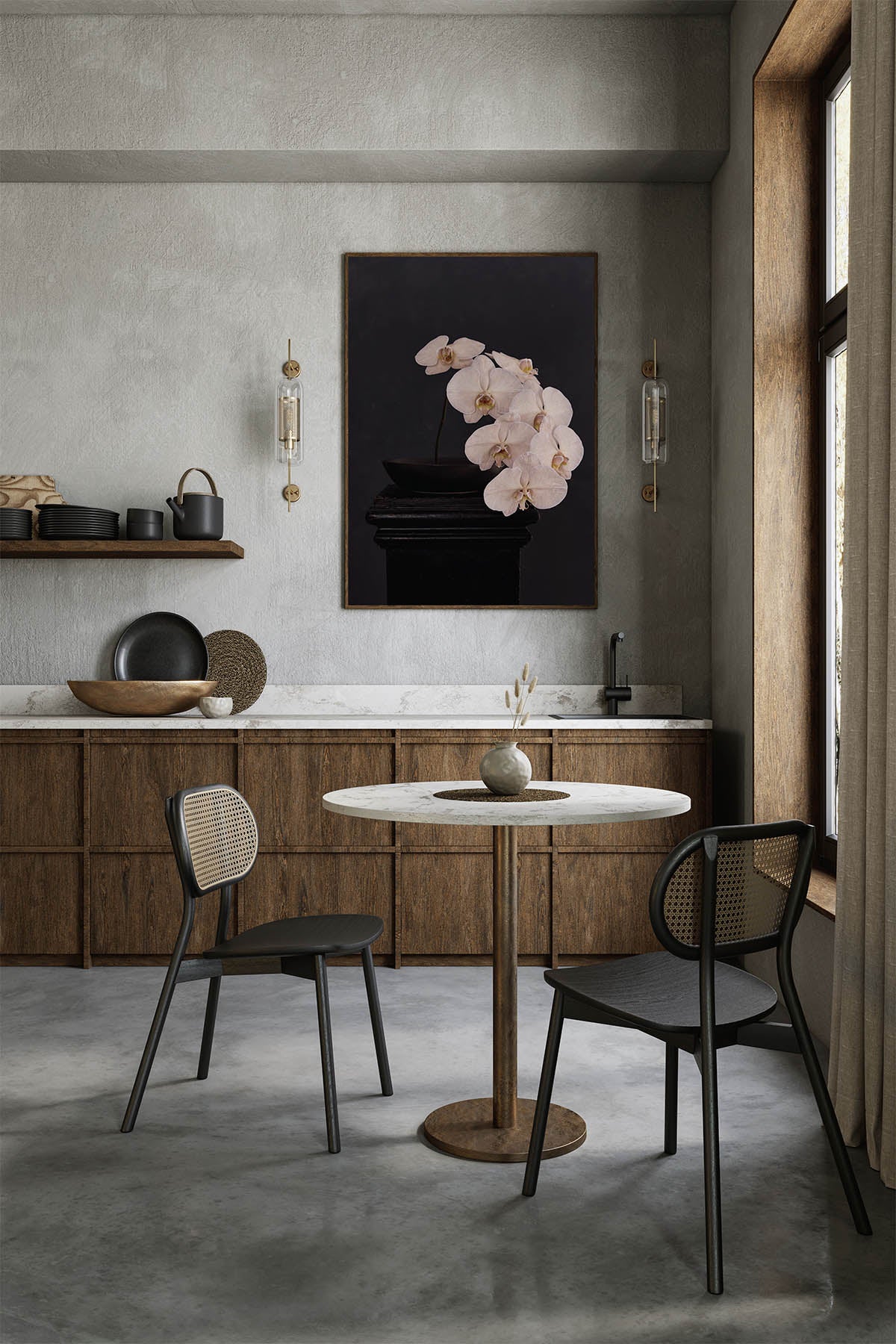 Fine Art Print Of A White Phaleanopsis Stem In A Black Bowl On A Black Mantle With A Black Rustic Background In A Modern Kitchen With Walnut Cabinetry and A Danish Table With 2 Chairs In Black With Mesh Backs. 