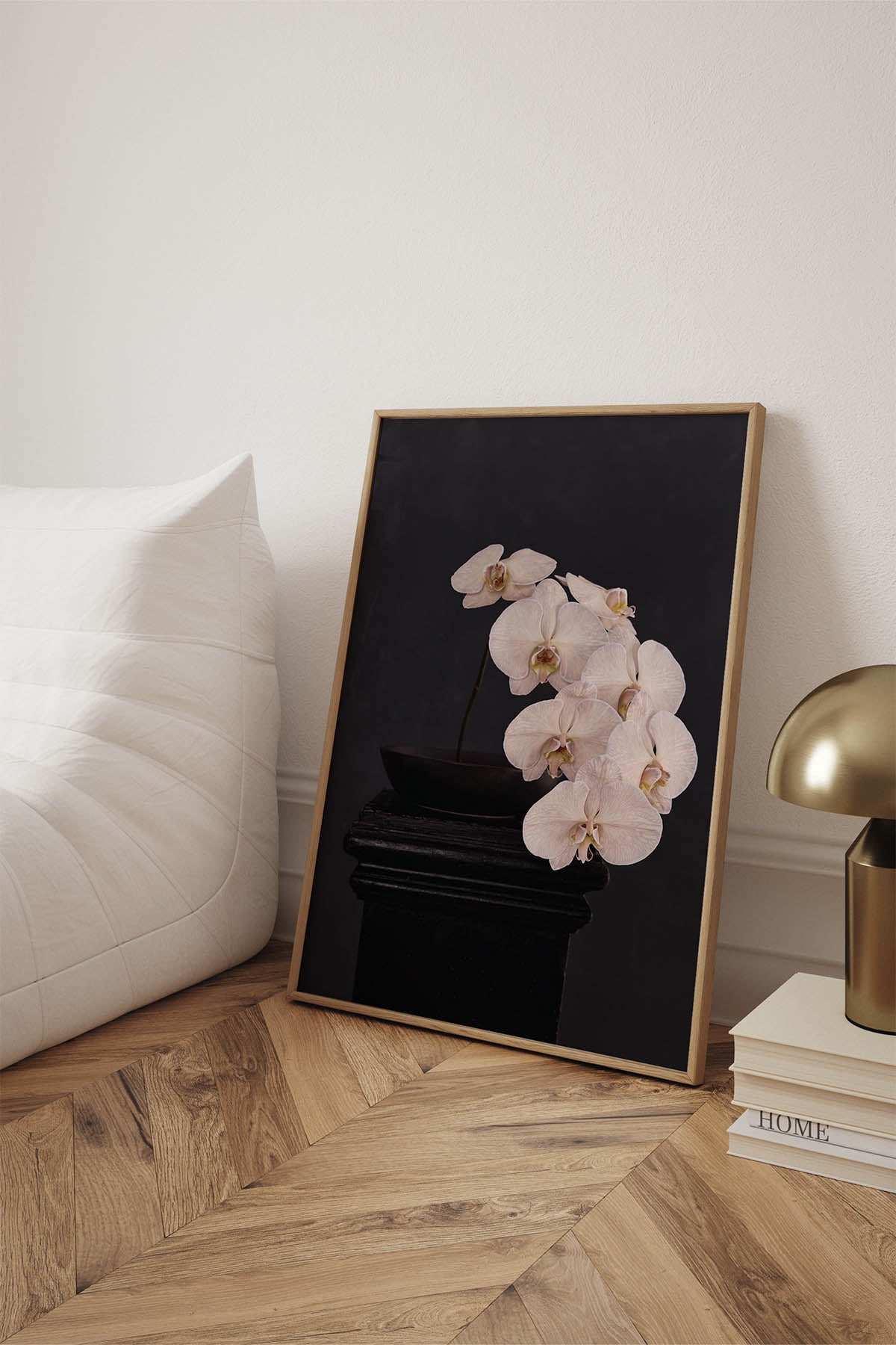 Fine Art Print Of A White Phaleanopsis Stem In A Black Bowl On A Black Mantle With A Black Rustic Background Leaning Against A Wall In A Living Room With A Linge Roset Chair 
