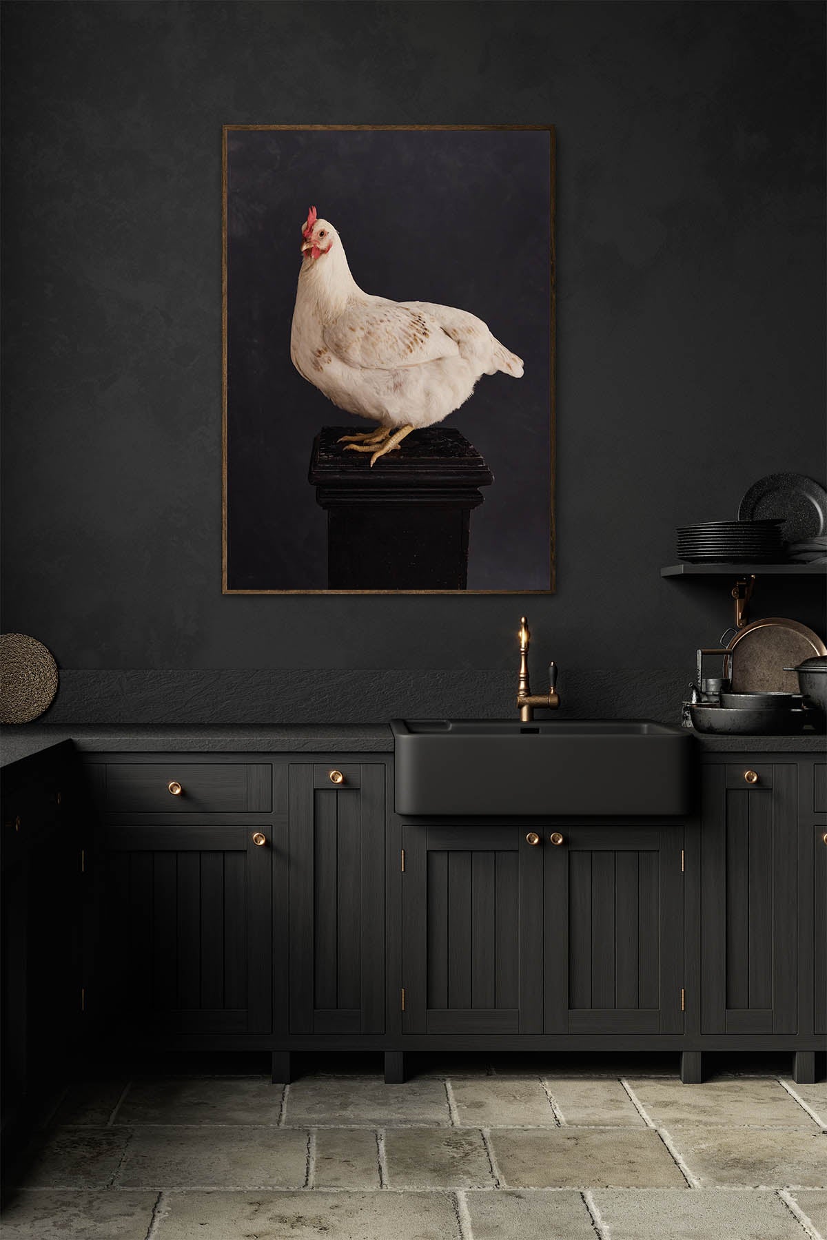 Fine Art Print Of A White Chicken Standing On A Black Plinth With A Black Background Framed On A Wall In An European Style Kitchen with a Trough Sink and Brass Tap.