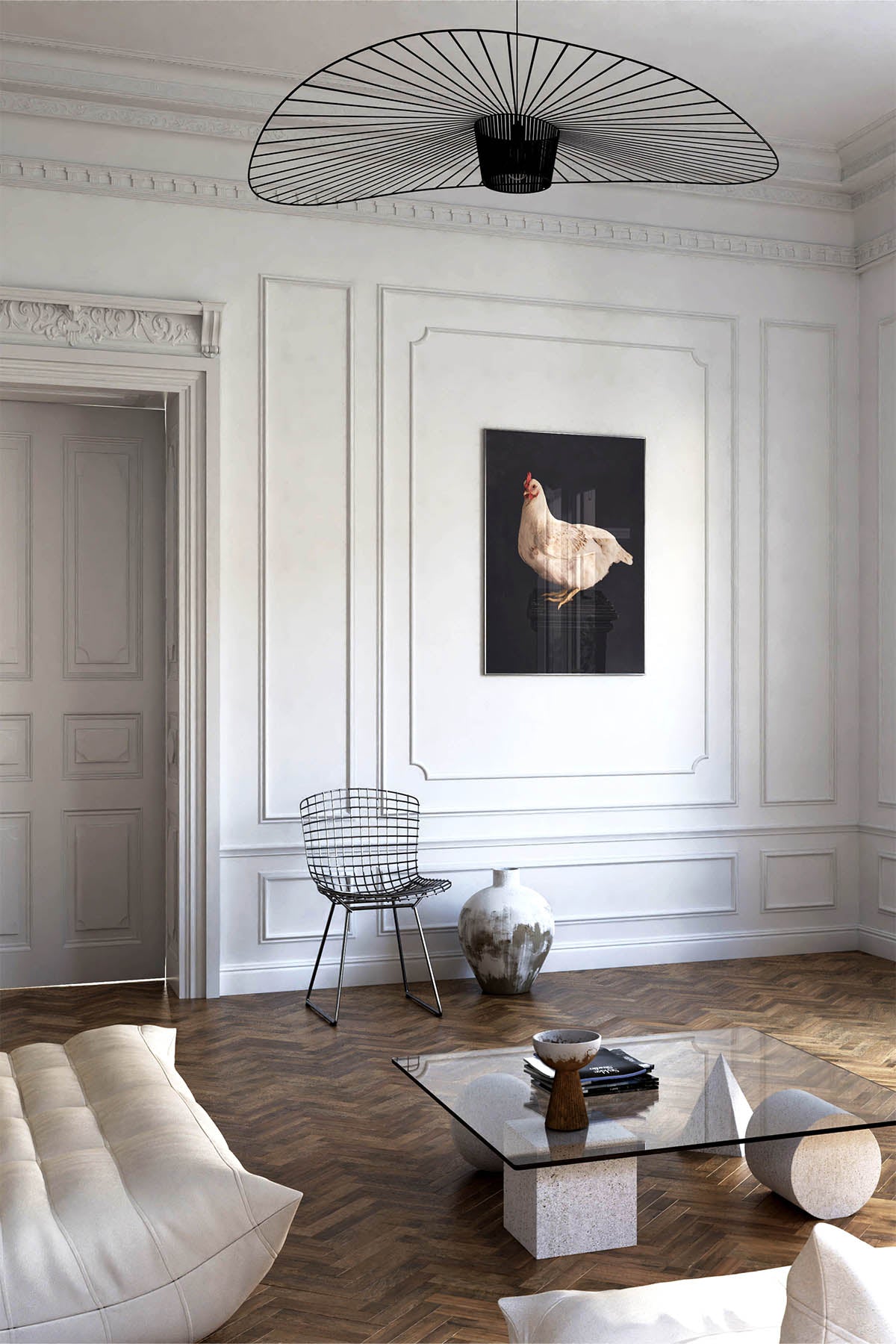 Fine Art Print Of A White Chicken Standing On A Black Plinth With A Black Background Framed On A Wall In An European Style Entry Way or Living Room Near A Harry Bertoia Mid Century Wire Chair and Cream Linge Roset Couch.