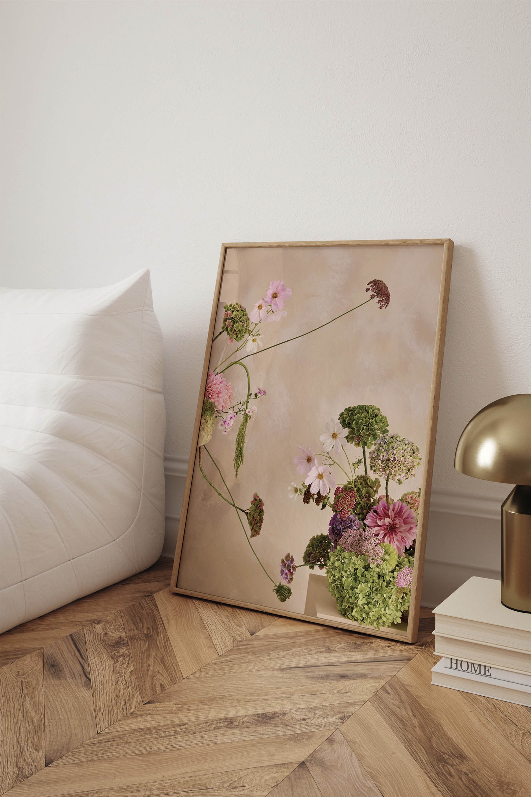 Whimsical Floral Abstract Arrangement against a Linen colour hand painted background Fine Art Print By Austin Bloom A1 size framed in oak leaning against a wall on a herringbone timber floor.