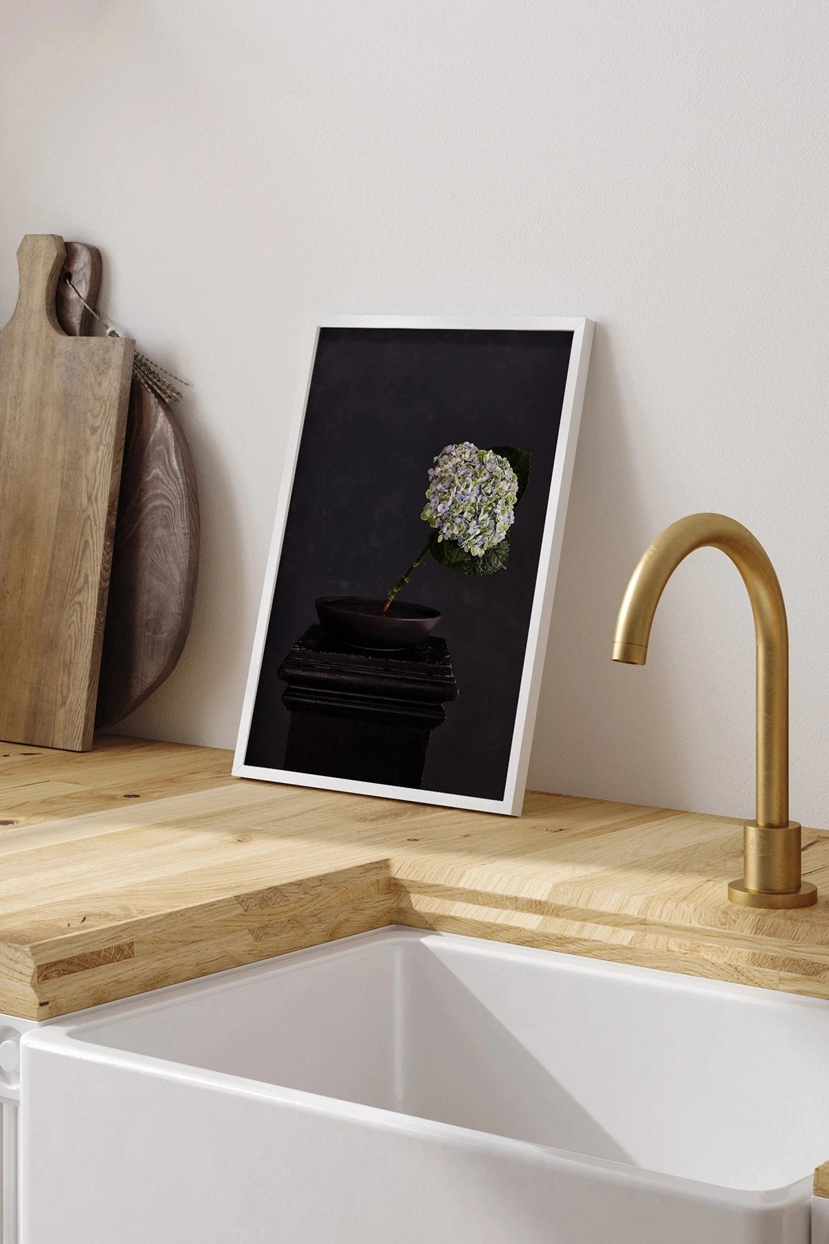 Austin Bloom Fine Art Print Exhale - Limited Edition sitting Kitchen counter with a white sink, gold faucet, wooden cutting board.