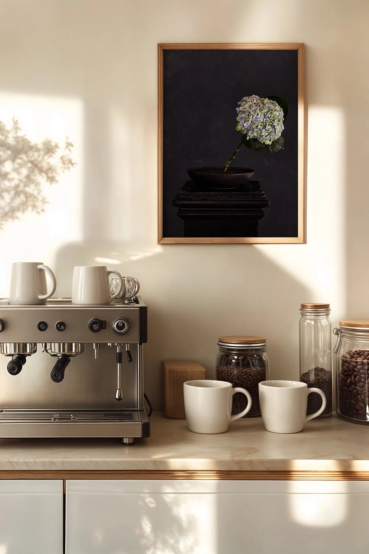 Austin Bloom Fine Art Print Exhale - Limited Edition styled in Kitchen counter with coffee machine, mugs, and a framed picture of a flower on the wall.