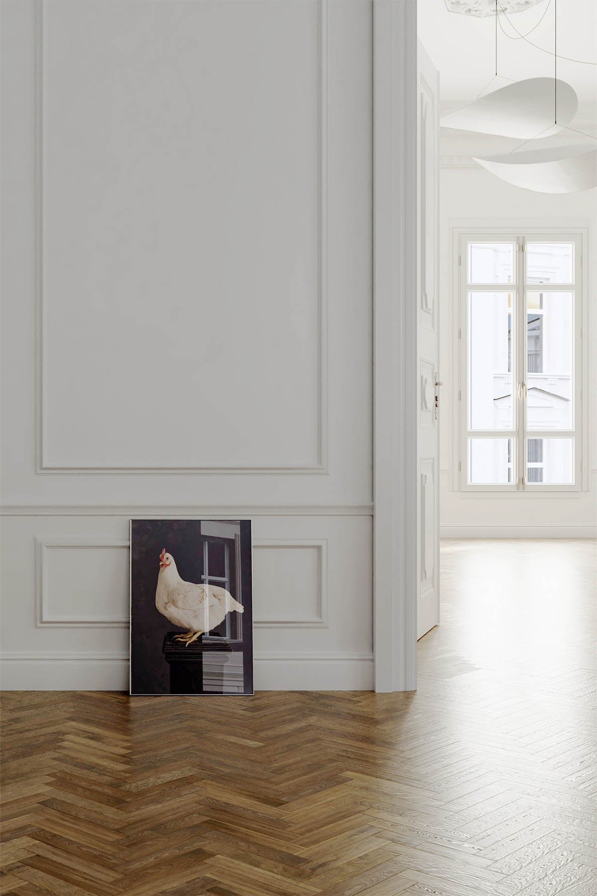 Fine Art Print Of A White Chicken Standing On A Black Plinth With A Black Background Framed On A Wall In An European Style Entry Way leaning against a wall sitting on european oak herringbone flooring.