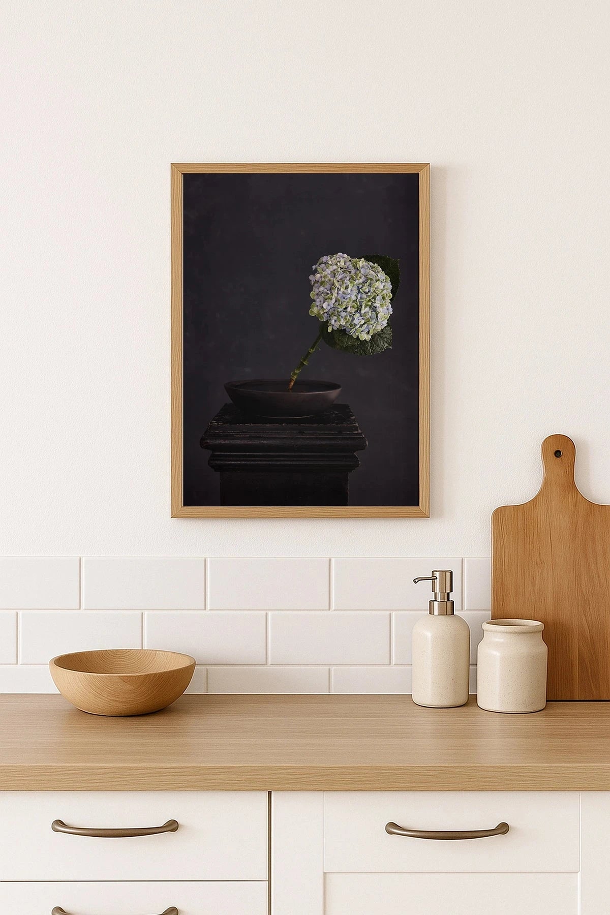 Austin Bloom Fine Art Print Exhale - Limited Edition hung above Kitchen counter with a framed artwork, cutting board, and kitchen items.