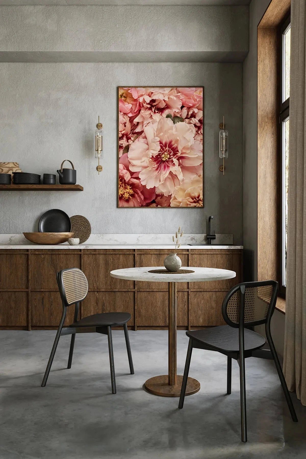 Fine art print of layered pink and burgundy peonies with golden centres displayed above a marble dining table in a contemporary kitchen with sage green walls